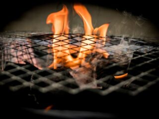 Smoky fire under grill